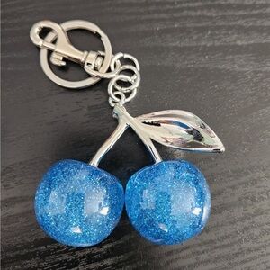 Cherry Blue bag charm w/ silver leafs sparkle shines looks pretty on your purse